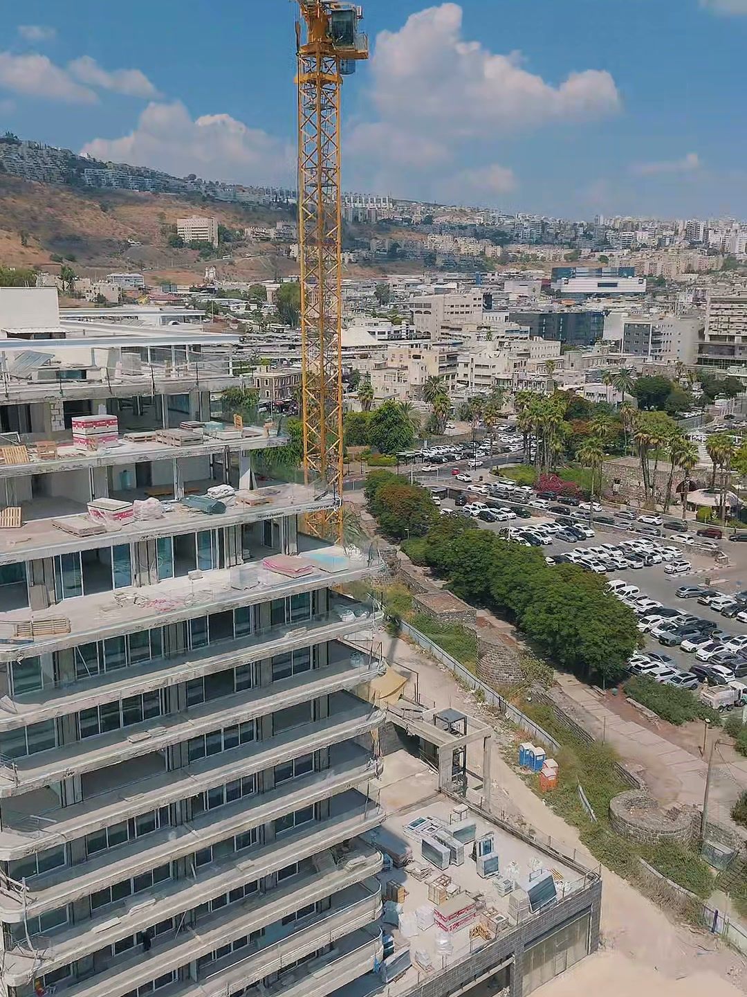 The residence at the time of filming (construction under way), with Tiberias beyond