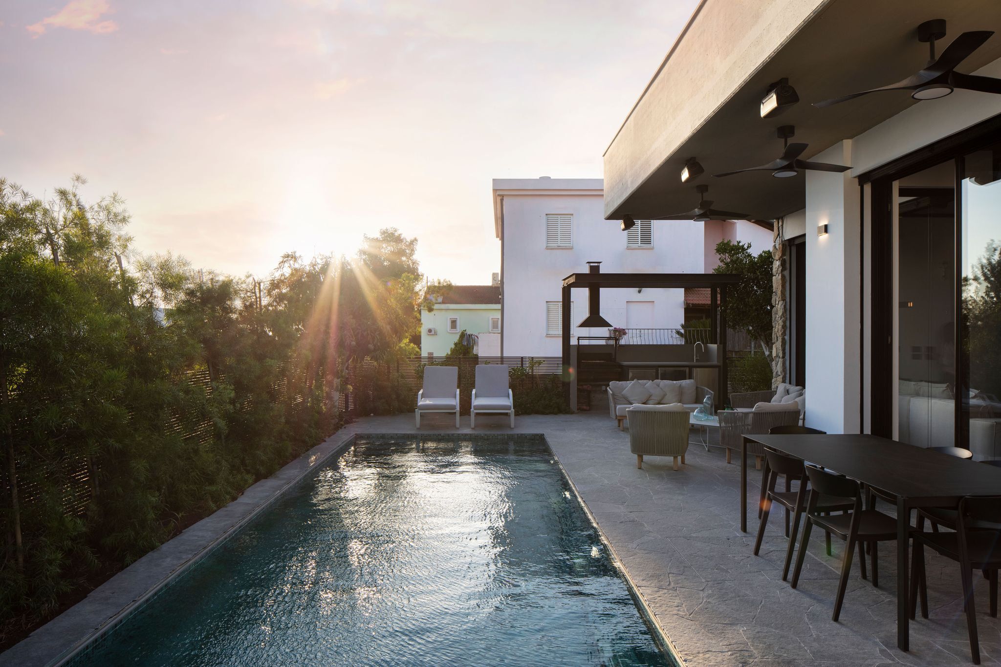 Pool and terrace at sunset